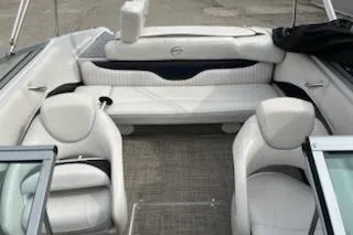 Slide: The Image of 2011 Crownline 21 SS boat interior with white seating and open cockpit design. - 9
