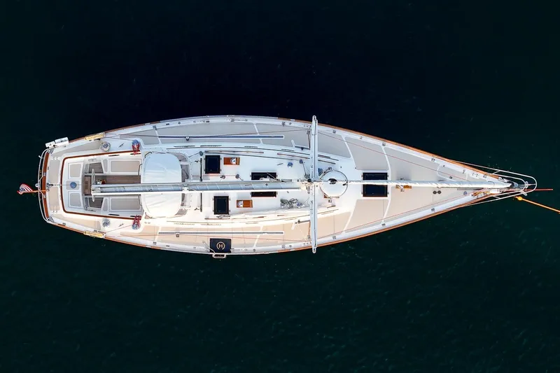 Slide: The Image of Aerial view of 1989 Hinckley Sou'wester 51 yacht on calm water. - 10