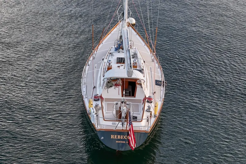 Slide: The Image of Aerial view of 1989 Hinckley Sou'wester 51 sailboat on calm water. - 11