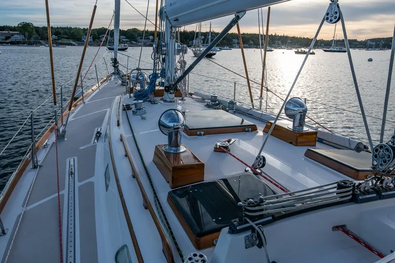 Slide: The Image of Hinckley Sou'wester 51 sailboat deck, 1989 model, on calm waters at sunset. - 20