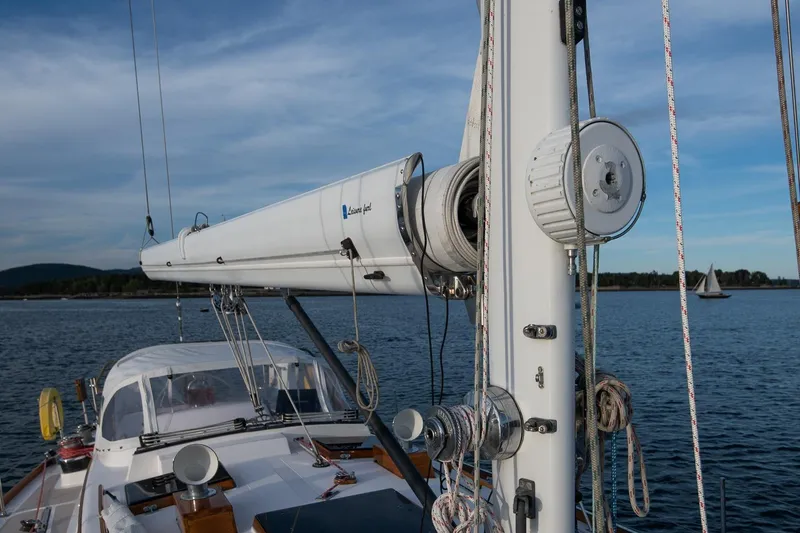 Slide: The Image of Hinckley Sou'wester 51 sailboat mast and rigging on calm water, 1989 model. - 25
