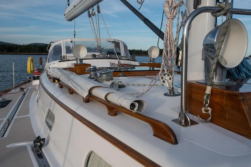 Slide: The Image of 1989 Hinckley Sou'wester 51 sailboat deck with rigging and wooden details. - 27