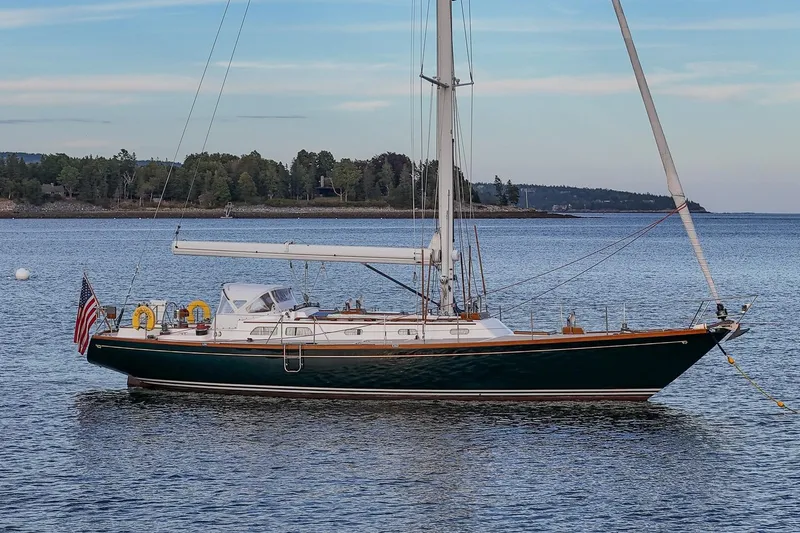 Slide: The Image of Sailing yacht Hinckley Sou'wester 51, 1989 model, anchored in serene waters. - 3