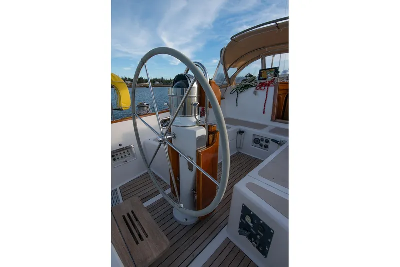 Slide: The Image of Cockpit of 1989 Hinckley Sou'wester 51 sailboat with steering wheel and nautical equipment. - 30