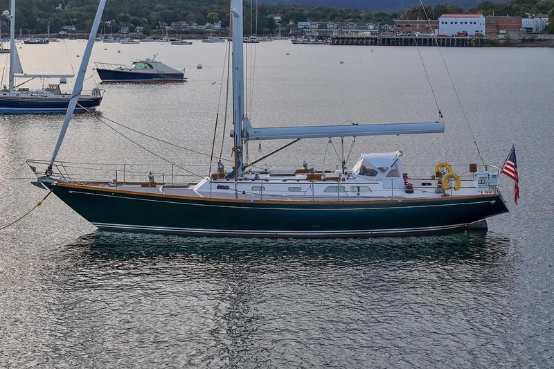Slide: The Image of Sailboat Hinckley Sou'wester 51, 1989 model, anchored in a serene harbor. - 4