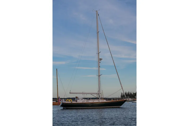 Slide: The Image of Sailing yacht Hinckley Sou'wester 51, 1989 model, on calm waters under a blue sky. - 6