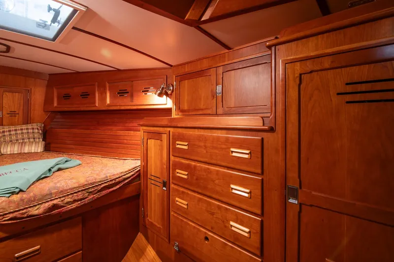 Slide: The Image of Luxurious wooden cabin interior of 1989 Hinckley Sou'wester 51 sailboat, featuring ample storage. - 62