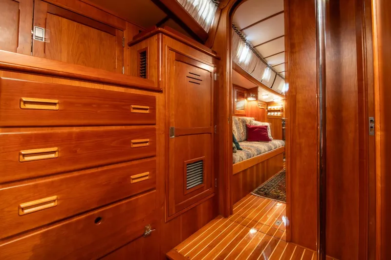 Slide: The Image of Luxurious wooden interior of 1989 Hinckley Sou'wester 51 yacht, featuring elegant cabinetry and seating. - 64