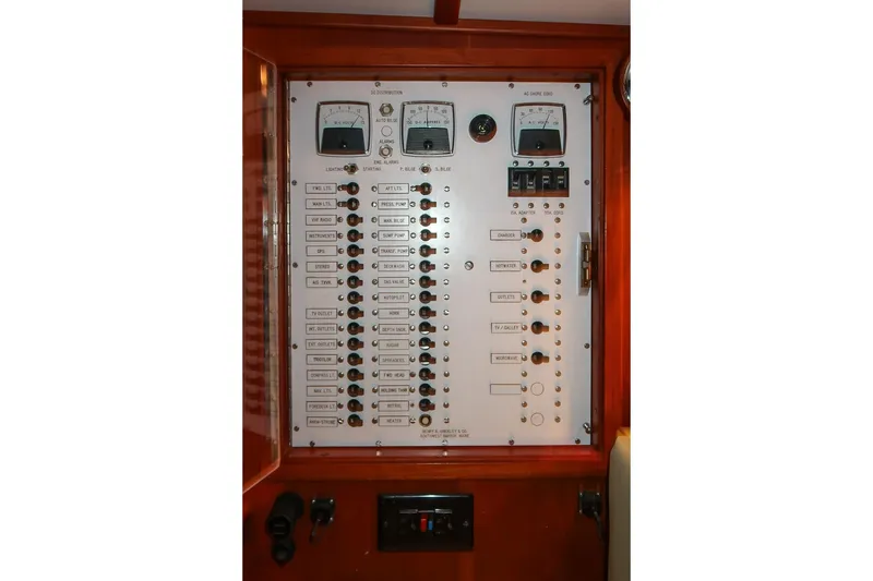 Slide: The Image of Electrical control panel on a 1989 Hinckley Sou'wester 51 yacht, featuring gauges and switches. - 69