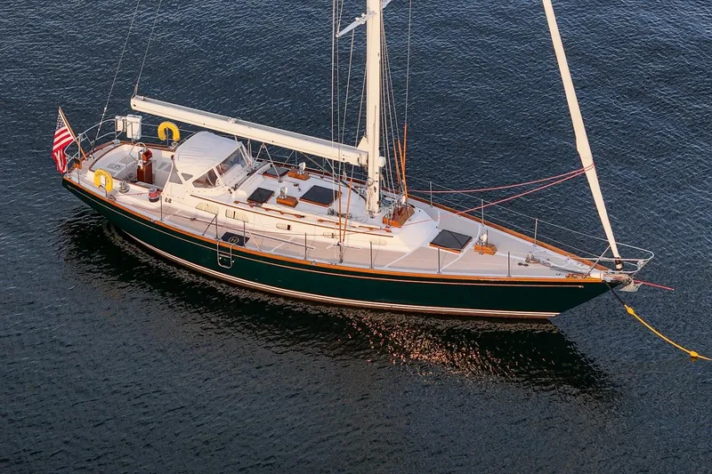 Slide: The Image of 1989 Hinckley Sou'wester 51 sailboat on calm water, showcasing elegant design and craftsmanship. - 7