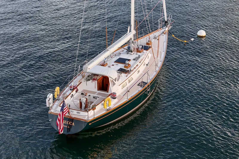 Slide: The Image of Sailing yacht Hinckley Sou'wester 51, 1989 model, anchored on calm water. - 8