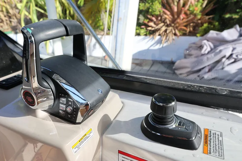 Slide: The Image of Control panel of 2025 Boston Whaler 325 Conquest boat with joystick and throttle. - 11