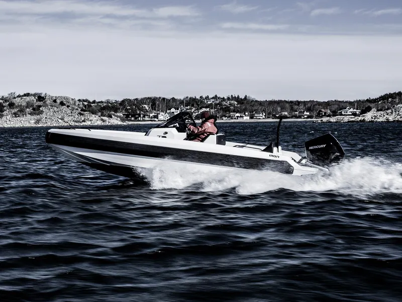 Slide: The Image of Manufacturer Provided Image: 2025 Iron 707 speedboat cruising on open water, showcasing sleek design and powerful performance. - 13