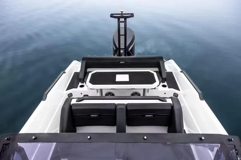 Slide: The Image of Manufacturer Provided Image: 2025 Iron 707 boat interior with sleek seating and modern design on calm water. - 17