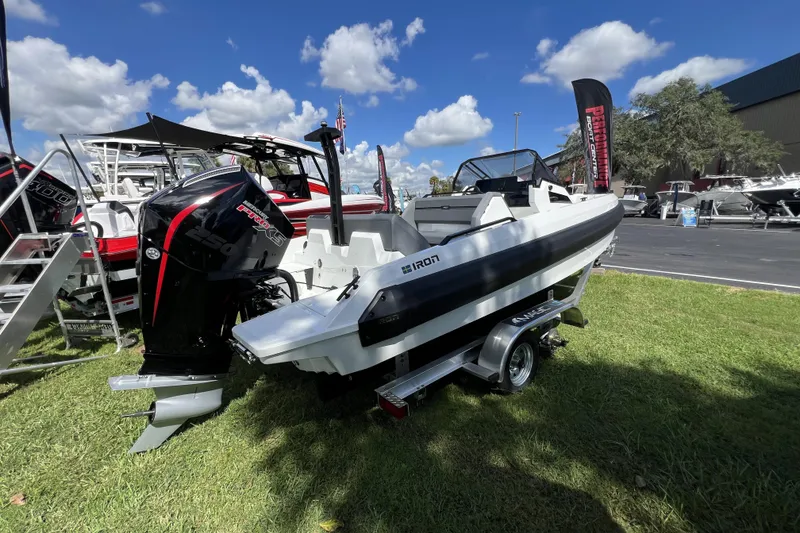 Slide: The Image of 2026 Iron 707 boat with powerful engine on display under blue sky. - 3