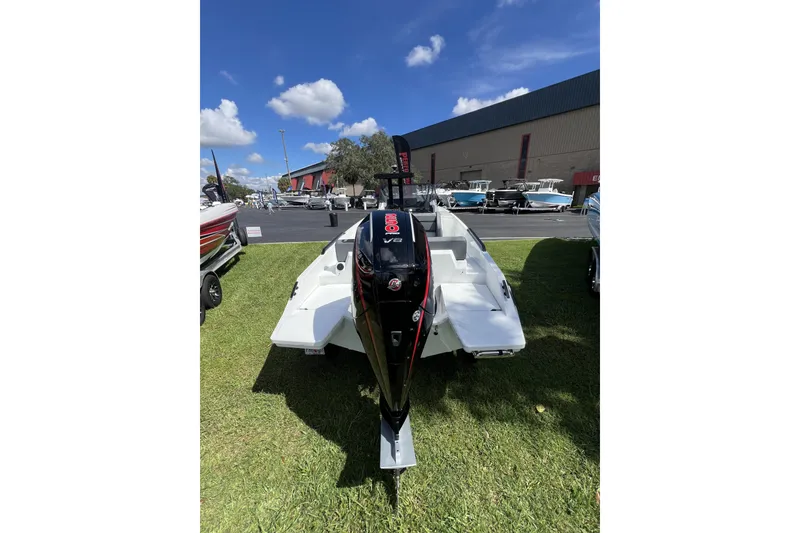 Slide: The Image of 2026 Iron 707 boat with powerful outboard motor displayed outdoors. - 5