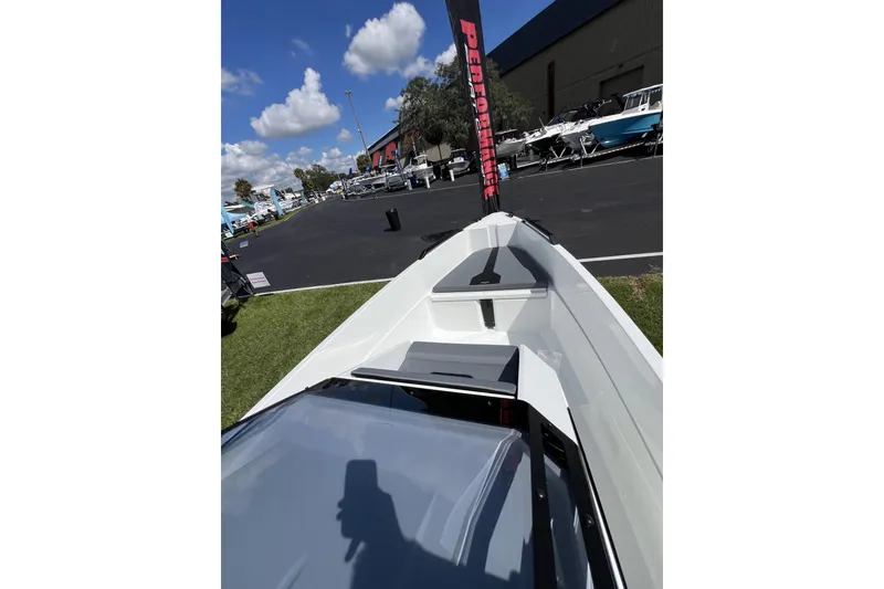 Slide: The Image of Front view of 2026 Iron 707 boat at outdoor exhibition under blue sky. - 8