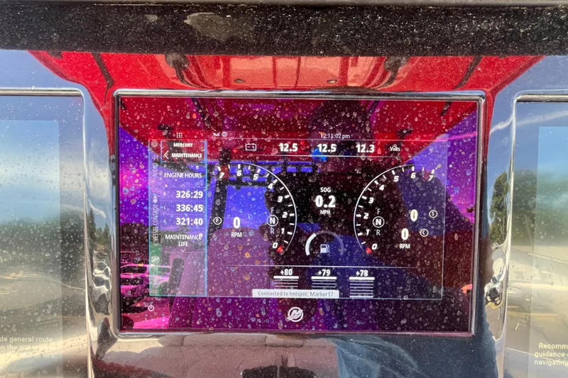 Slide: The Image of Dashboard of 2023 Fountain 38 Tournament Edition boat displaying engine hours and maintenance data. - 13