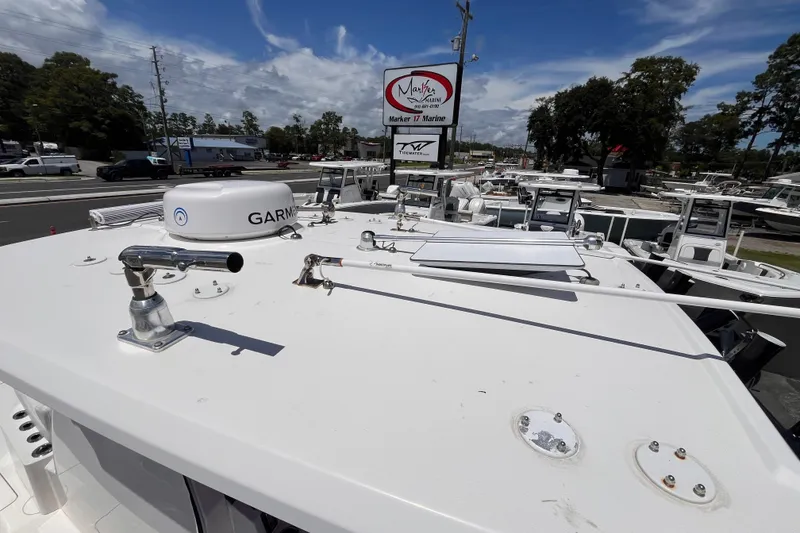 Slide: The Image of 2023 Fountain 38 Tournament Edition boat with Garmin equipment, displayed at a marine dealership. - 23