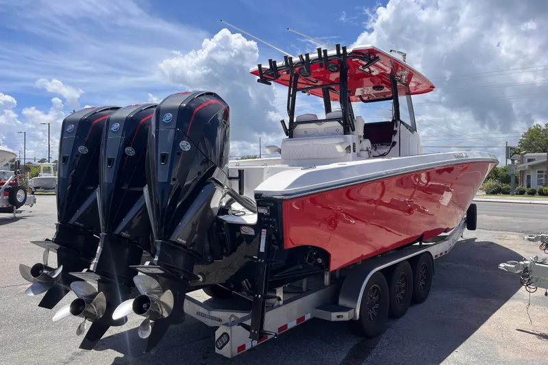 Slide: The Image of 2023 Fountain 38 Tournament Edition boat with triple outboard engines on a trailer. - 5