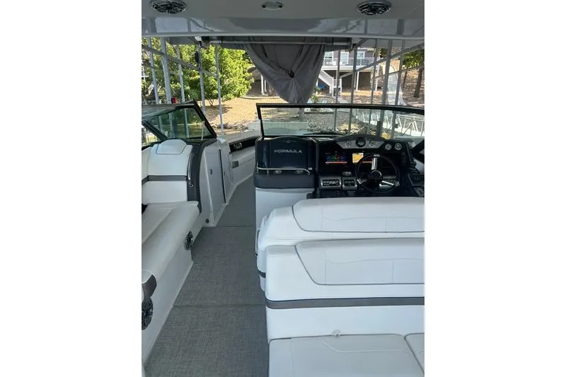 Slide: The Image of 2023 Formula 350 Crossover Bowrider I/O interior with sleek seating and modern dashboard. - 3