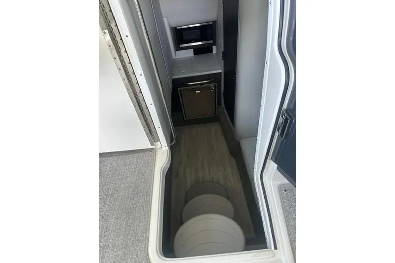 Slide: The Image of Interior view of 2023 Formula 350 Crossover Bowrider I/O cabin with kitchenette. - 6
