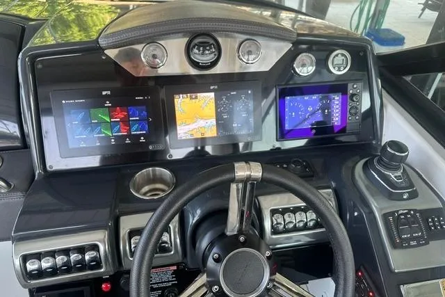 Slide: The Image of Dashboard of 2023 Formula 350 Crossover Bowrider I/O with advanced navigation displays. - 7