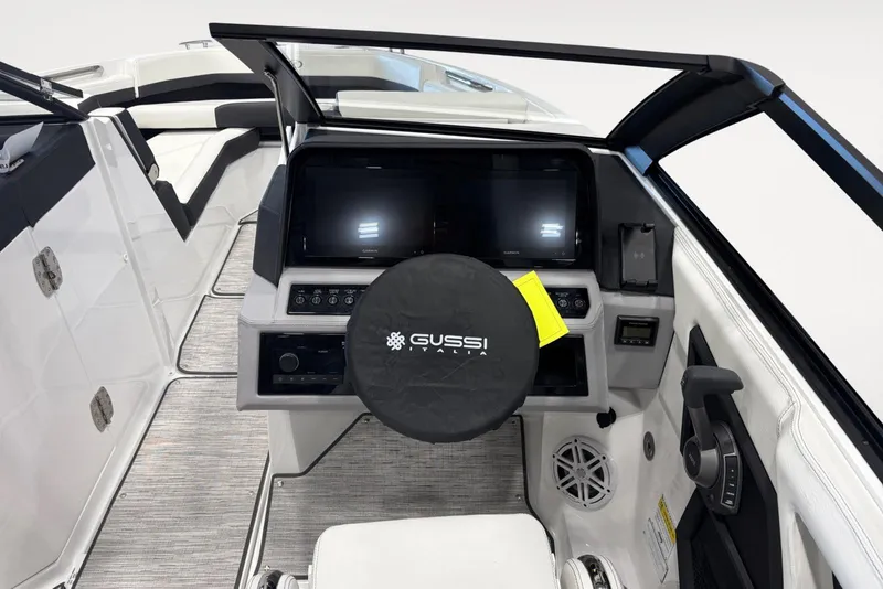 Slide: The Image of Interior of 2026 Cobalt R6 boat with modern dashboard and steering wheel cover. - 11
