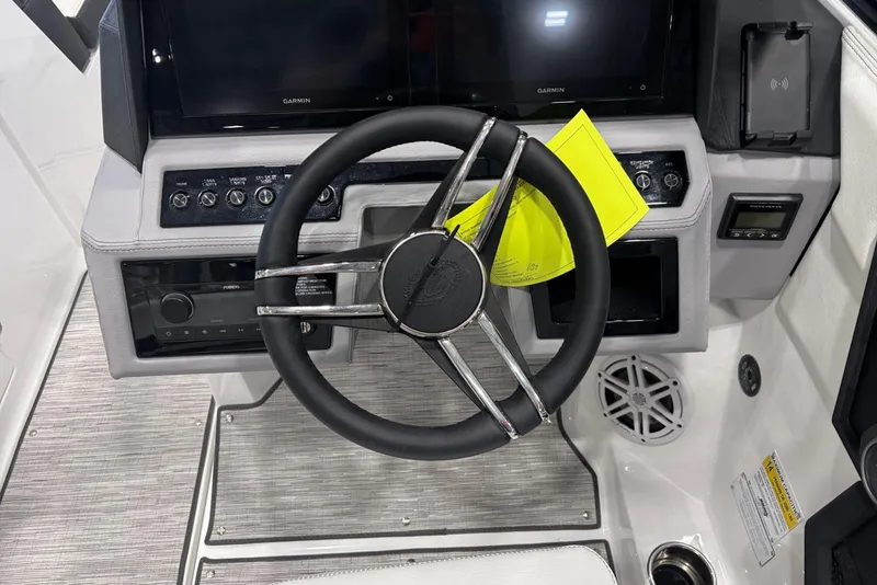 Slide: The Image of 2026 Cobalt R6 boat dashboard with steering wheel and control panel. - 12