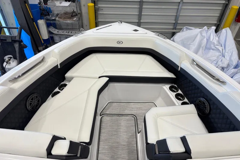 Slide: The Image of 2026 Cobalt R6 boat interior with white seating and modern design. - 16