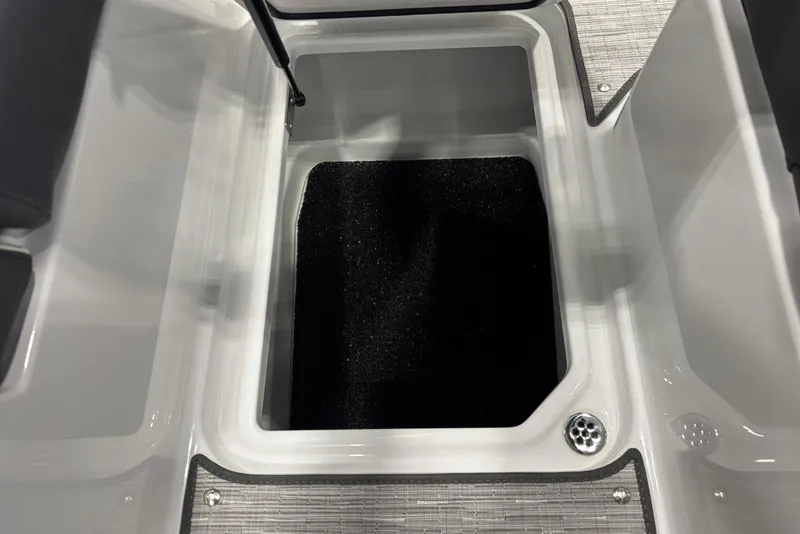 Slide: The Image of 2026 Cobalt R6 boat storage compartment with black interior and sleek design. - 19
