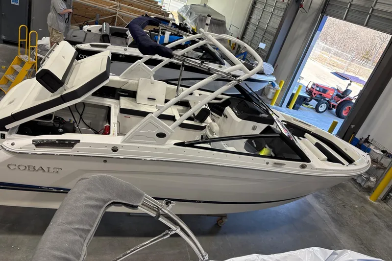 Slide: The Image of 2026 Cobalt R6 boat in a garage, showcasing sleek design and modern features. - 6