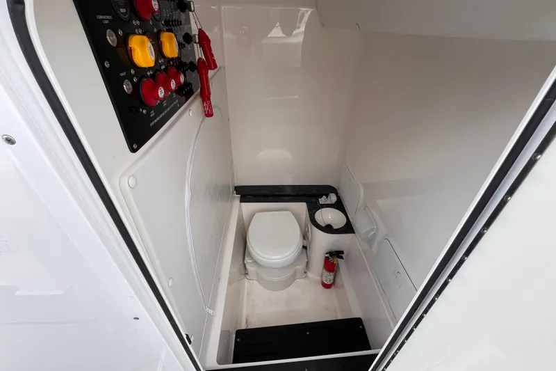 Slide: The Image of Interior of 2026 Fountain 38 Tournament Edition boat with toilet and control panel. - 13