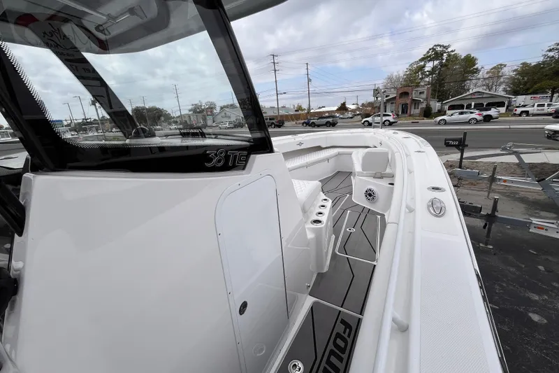 Slide: The Image of 2026 Fountain 38 Tournament Edition boat, sleek design, docked outdoors, showcasing spacious deck. - 14