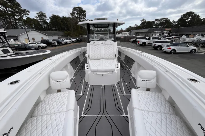 Slide: The Image of 2026 Fountain 38 Tournament Edition boat with sleek white seating and modern design. - 16