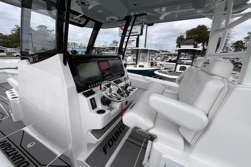 Slide: The Image of 2026 Fountain 38 Tournament Edition boat interior with modern helm and luxurious seating. - 19