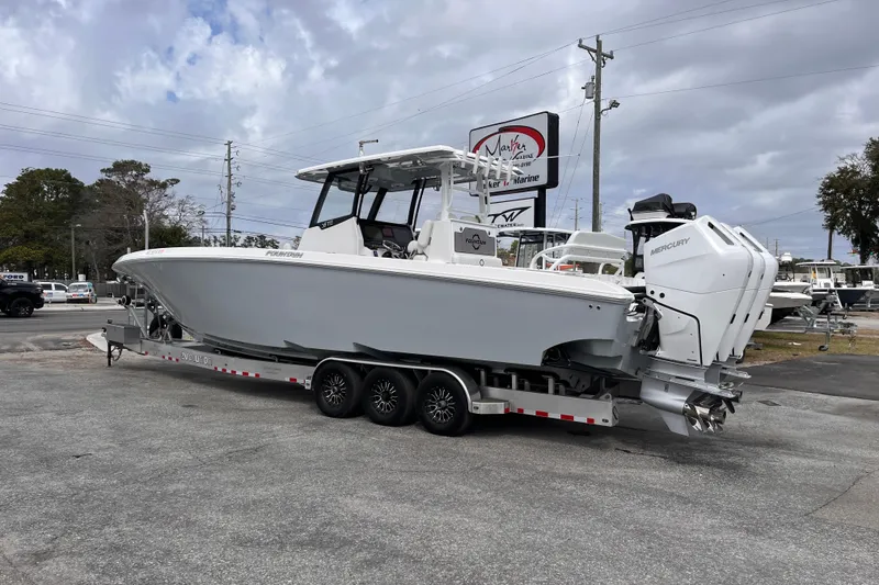 Slide: The Image of 2026 Fountain 38 Tournament Edition boat on trailer, parked outdoors under cloudy sky. - 3