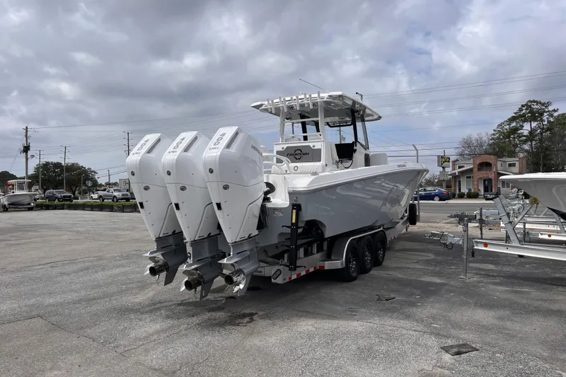 Slide: The Image of 2026 Fountain 38 Tournament Edition boat with triple outboard engines on a trailer. - 5