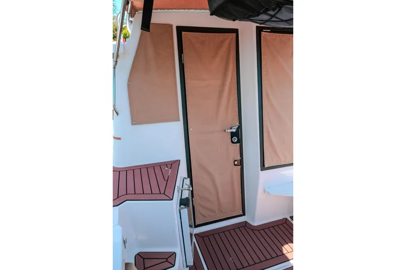 Slide: The Image of 2024 FML R27 LE boat interior with tan covers and sleek design. - 11