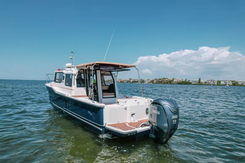 Slide: The Image of 2024 FML R27 LE boat on water with Yamaha 300 V6 engine. - 21