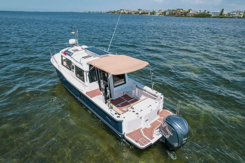 Slide: The Image of 2024 FML R27 LE boat cruising on clear blue water, featuring a sleek design and powerful engine. - 5