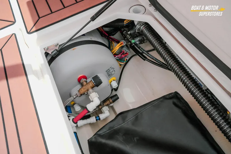 Slide: The Image of 2024 Ranger Tugs R-27 boat interior showing mechanical components and wiring. - 71