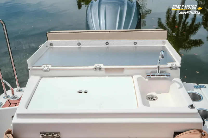Slide: The Image of 2024 Ranger Tugs R-27 boat with outdoor sink and prep area by the water. - 75