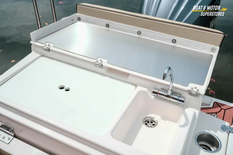 Slide: The Image of 2024 Ranger Tugs R-27 boat sink and counter setup with faucet. - 76