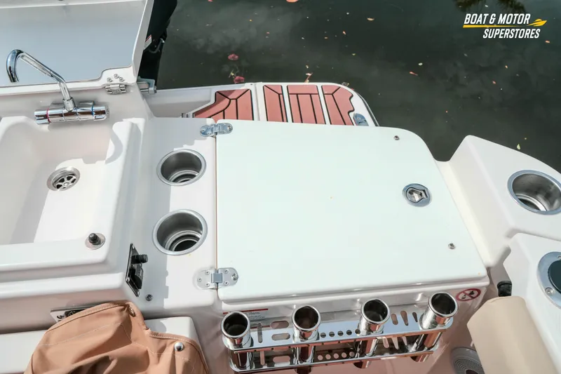 Slide: The Image of 2024 Ranger Tugs R-27 boat deck with sink and storage compartments. - 77