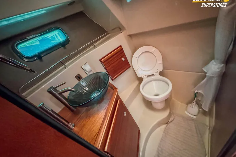 Slide: The Image of 2024 Ranger Tugs R-27 bathroom with modern sink and toilet. - 84