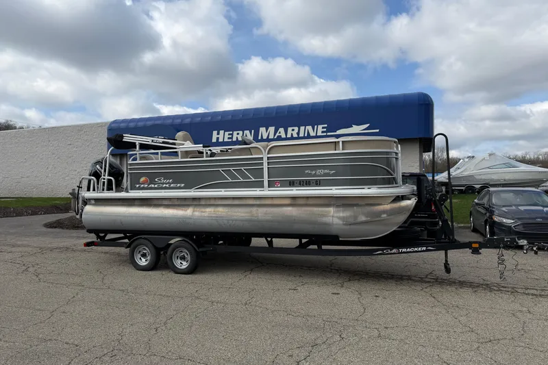 The Image of 2022 Sun Tracker Party Barge 20 DLX pontoon boat on trailer at Hern Marine dealership. - 0