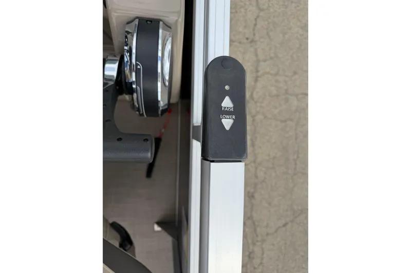 Slide: The Image of Control panel on 2022 Sun Tracker Party Barge 20 DLX with raise and lower buttons. - 12