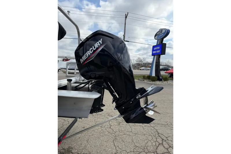 Slide: The Image of 2022 Sun Tracker Party Barge 20 DLX with Mercury outboard motor in parking lot. - 13