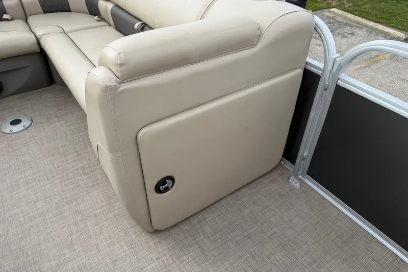 Slide: The Image of 2022 Sun Tracker Party Barge 20 DLX interior with beige seating and flooring. - 3